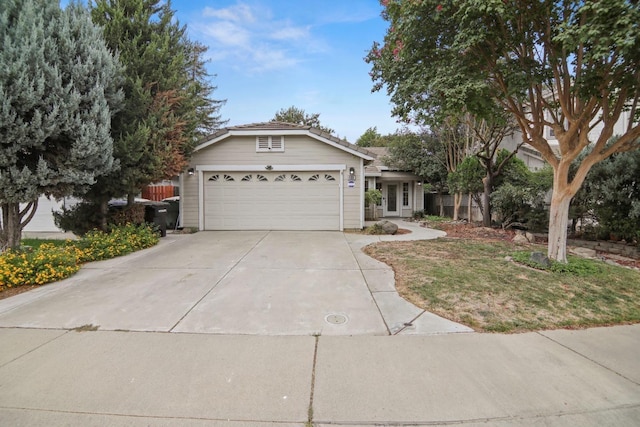 ranch-style house with an attached garage and driveway