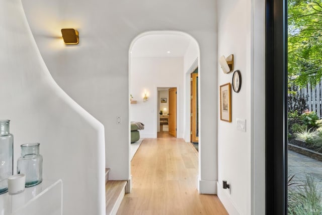 hallway with light wood-style floors