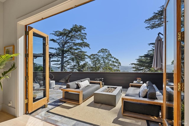 view of patio / terrace featuring an outdoor living space with a fire pit