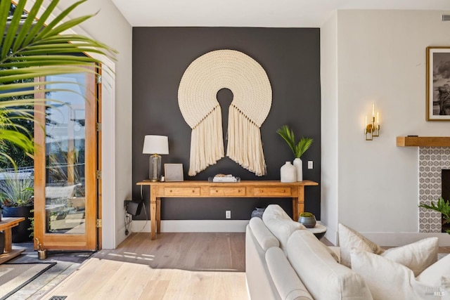 interior space with baseboards and wood finished floors