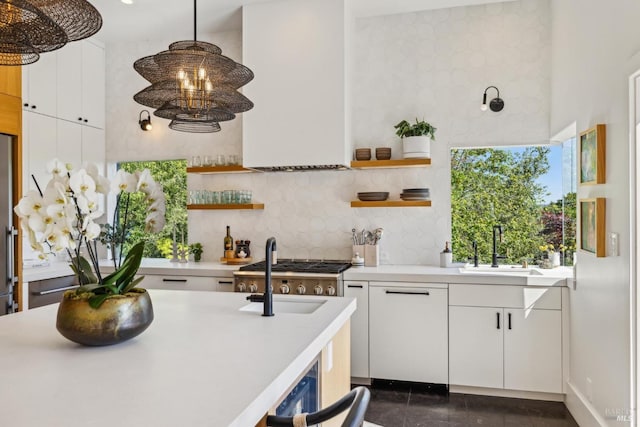 kitchen with light countertops, open shelves, and decorative backsplash