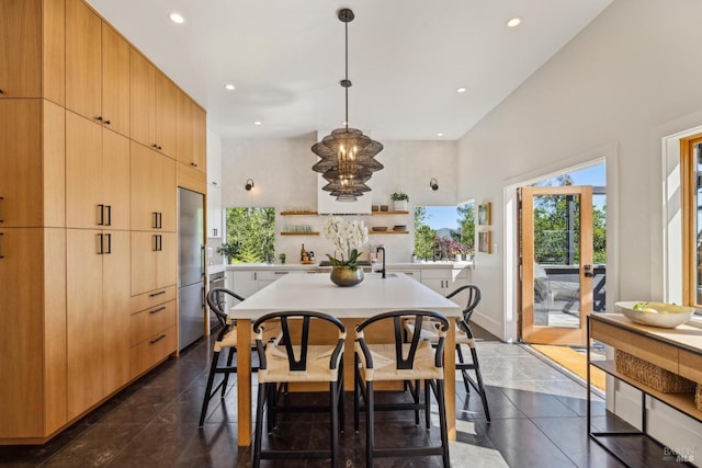 dining room featuring recessed lighting and baseboards