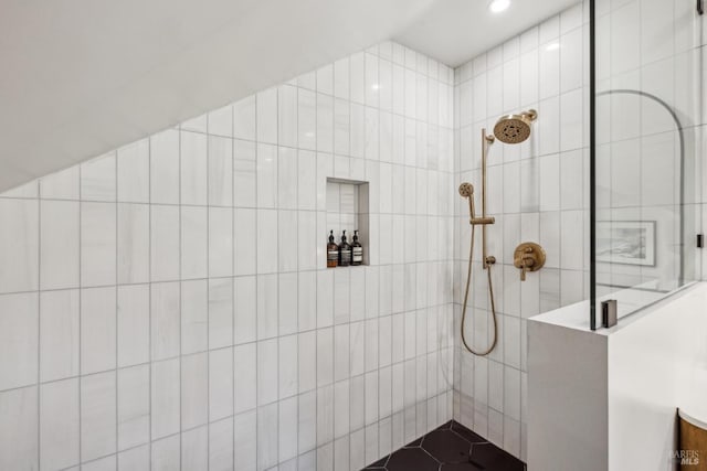 bathroom with recessed lighting and tiled shower