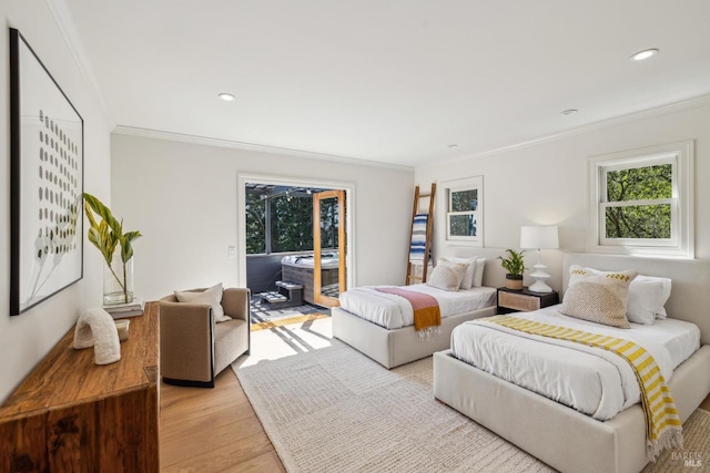 bedroom featuring crown molding, recessed lighting, light wood finished floors, and access to exterior