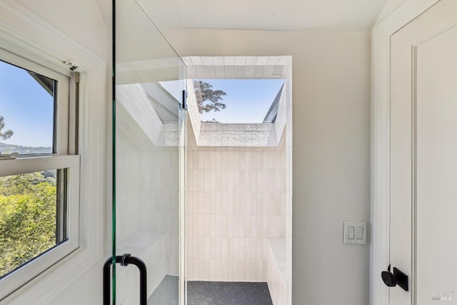 full bathroom with tiled shower