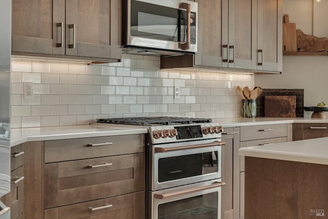6200 Burnside Rd, Sebastopol, CA 95472 - kitchen with stainless steel appliances, light countertops, and decorative backsplash