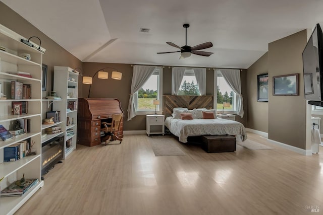 6200 Burnside Rd, Sebastopol, CA 95472 - bedroom with light wood-type flooring, baseboards, multiple windows, and vaulted ceiling