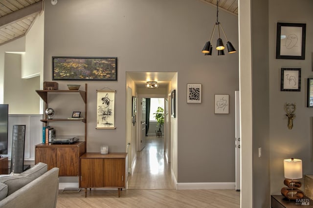 6200 Burnside Rd, Sebastopol, CA 95472 - living area featuring wood ceiling, light wood finished floors, baseboards, a chandelier, and high vaulted ceiling