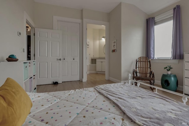 6200 Burnside Rd, Sebastopol, CA 95472 - bedroom with wood finished floors, baseboards, and ensuite bathroom