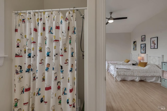 6200 Burnside Rd, Sebastopol, CA 95472 - ensuite bathroom with ceiling fan, a shower with shower curtain, wood finished floors, and lofted ceiling