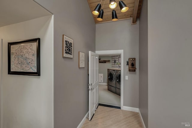 6200 Burnside Rd, Sebastopol, CA 95472 - corridor featuring washer and clothes dryer, wooden ceiling, wood finished floors, baseboards, and lofted ceiling