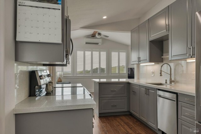 6200 Burnside Rd, Sebastopol, CA 95472 - kitchen with gray cabinets, stainless steel dishwasher, a sink, a wall mounted air conditioner, and lofted ceiling