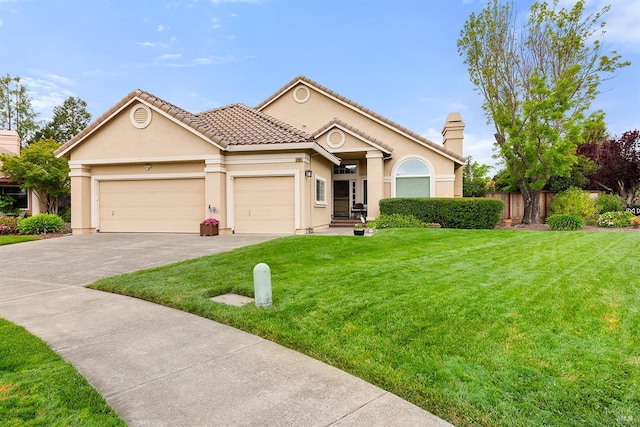view of front of property with a front yard, a garage, fence, concrete driveway, and stucco siding