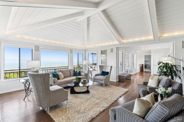 living room featuring baseboards, wood finished floors, high vaulted ceiling, and beamed ceiling