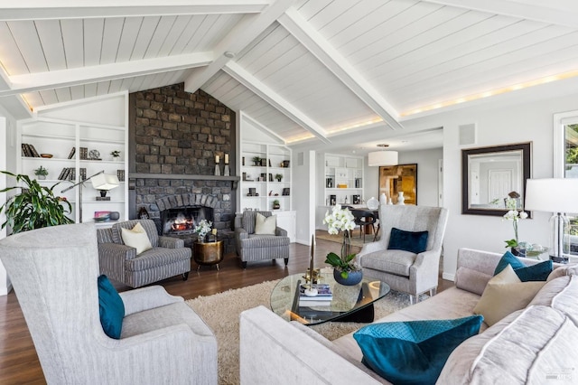 living area featuring a fireplace, dark wood finished floors, built in features, vaulted ceiling with beams, and visible vents