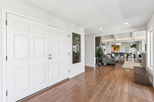 foyer with baseboards, recessed lighting, and hardwood / wood-style floors