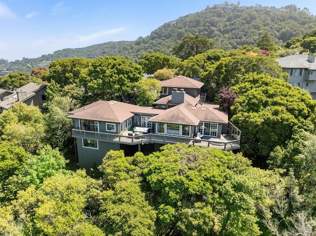 drone / aerial view featuring a forest view