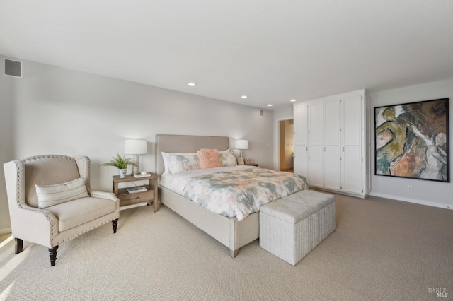 bedroom featuring baseboards, light colored carpet, recessed lighting, and visible vents