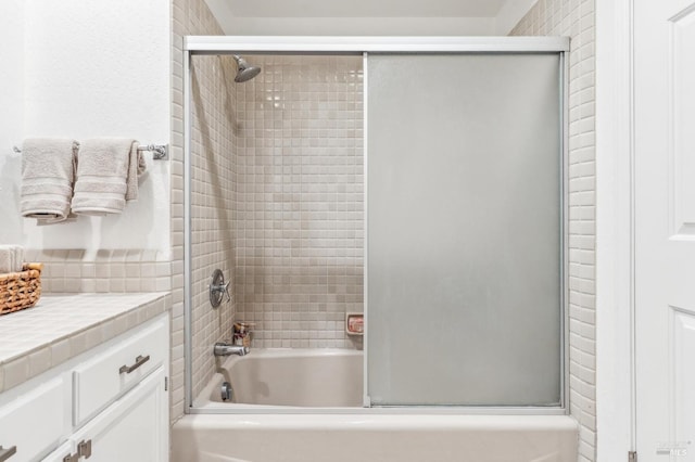 full bathroom featuring shower / bath combination with glass door