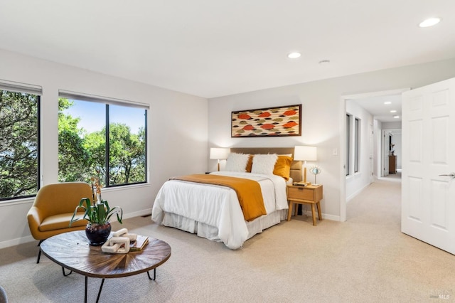 bedroom featuring baseboards, recessed lighting, and light carpet
