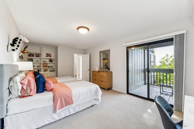 bedroom featuring carpet floors, baseboards, and access to exterior