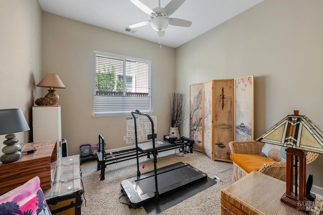 exercise room with ceiling fan, carpet flooring, and visible vents