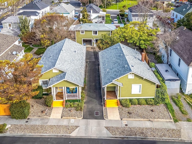birds eye view of property with a residential view