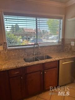 kitchen with crown molding, a sink, decorative backsplash, light tile patterned floors, and stainless steel dishwasher