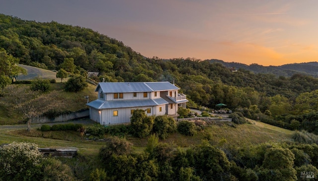 bird's eye view with a wooded view