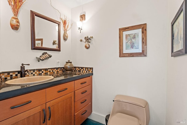 half bath featuring vanity, decorative backsplash, and toilet