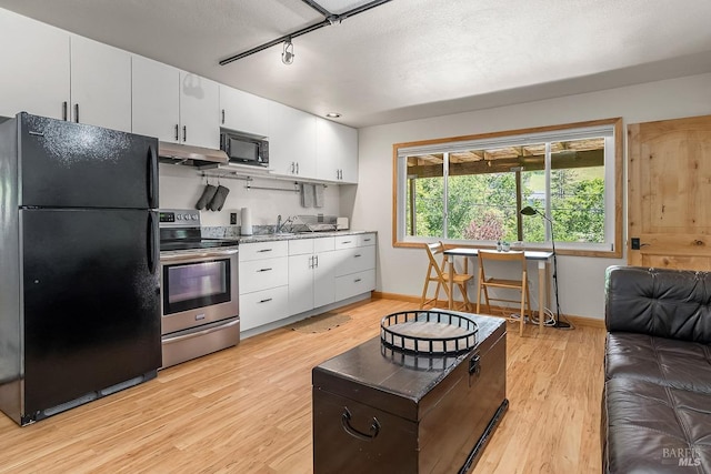 5 Oak Springs Dr, San Anselmo, CA 94960 - kitchen with baseboards, black appliances, light wood-type flooring, and under cabinet range hood