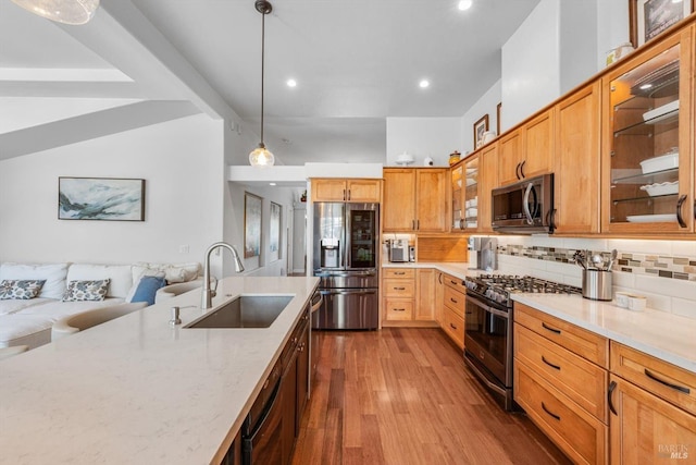 1300 Steele Canyon Rd, Napa, CA 94558 - kitchen featuring dark wood-type flooring, tasteful backsplash, light stone counters, a sink, and appliances with stainless steel finishes