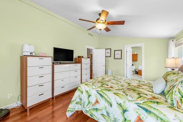 1300 Steele Canyon Rd, Napa, CA 94558 - bedroom featuring visible vents, wood finished floors, ceiling fan, connected bathroom, and vaulted ceiling