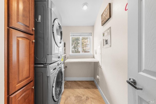 1300 Steele Canyon Rd, Napa, CA 94558 - clothes washing area with baseboards, stacked washer and dryer, and cabinet space