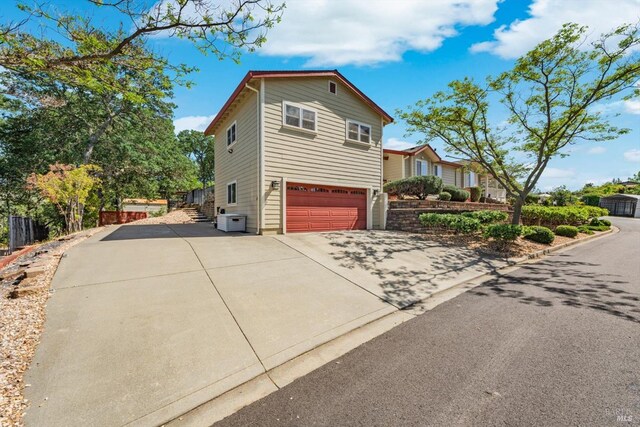 1300 Steele Canyon Rd, Napa, CA 94558 - view of side of property with driveway and a garage