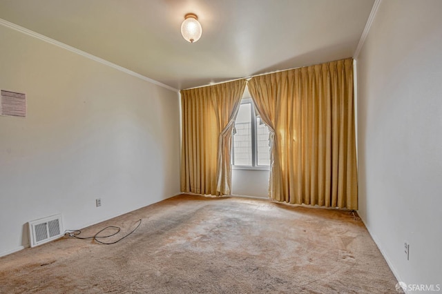 unfurnished room featuring crown molding, visible vents, and carpet floors