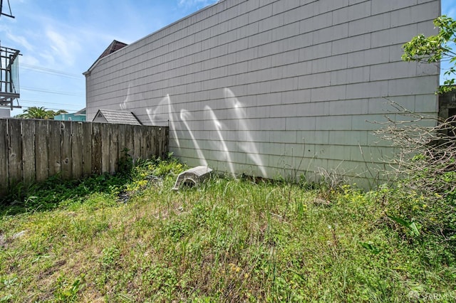 view of property exterior featuring fence