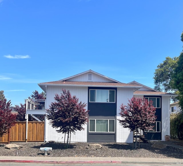 view of front of property featuring fence