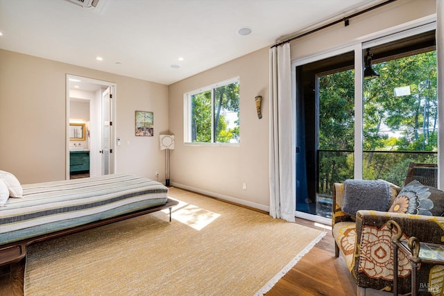 bedroom with baseboards, access to outside, recessed lighting, and wood finished floors