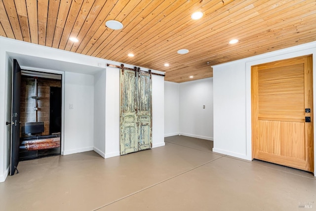 interior space featuring recessed lighting, baseboards, a barn door, and wood ceiling