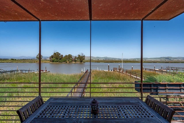 exterior space featuring a water and mountain view