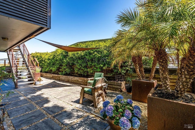 view of patio featuring stairway