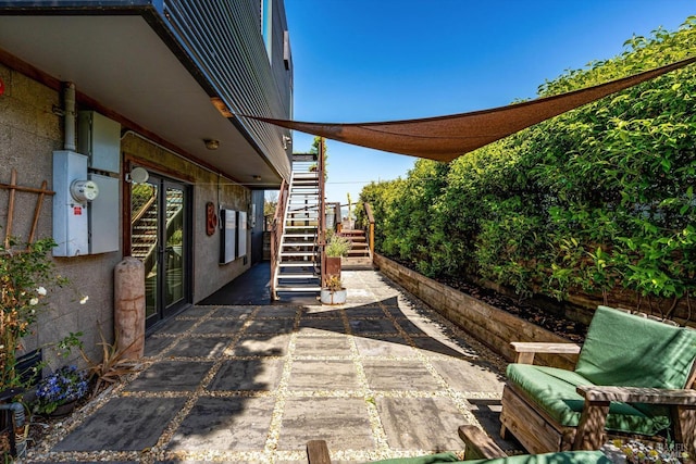 view of patio / terrace featuring stairway