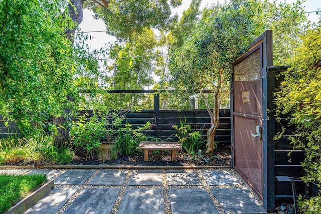 view of gate featuring fence