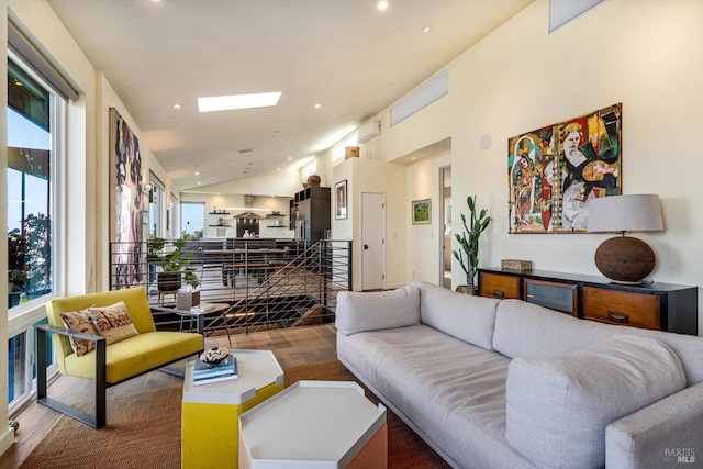 living area featuring a dry bar, recessed lighting, wood finished floors, and lofted ceiling