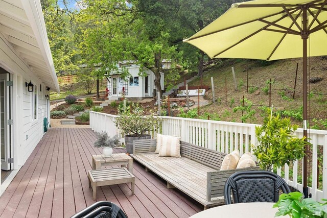 wooden terrace with an outdoor structure