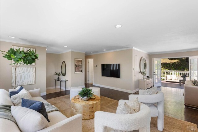 living area with baseboards, recessed lighting, and wood finished floors