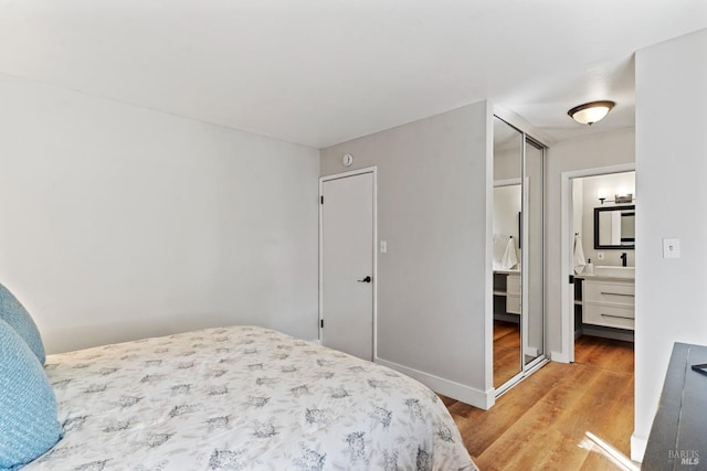 28 Washington St, Novato, CA 94947 - bedroom with light wood-type flooring and ensuite bathroom