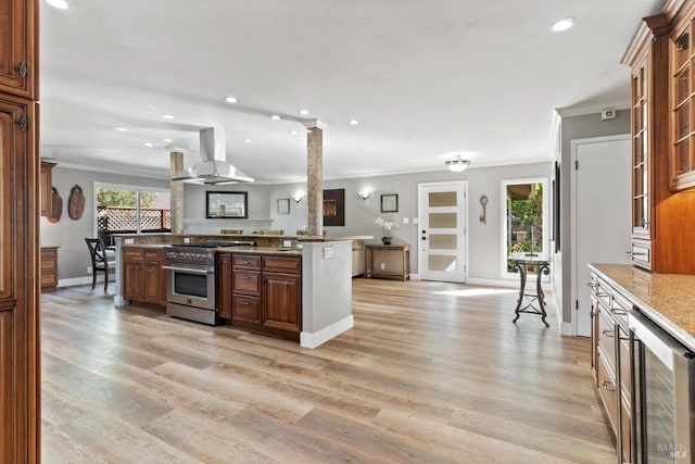 28 Washington St, Novato, CA 94947 - kitchen with exhaust hood, beverage cooler, crown molding, and stainless steel stove