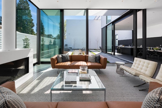 interior space with floor to ceiling windows and a healthy amount of sunlight